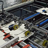 Вклейка окошек в картонные заготовки